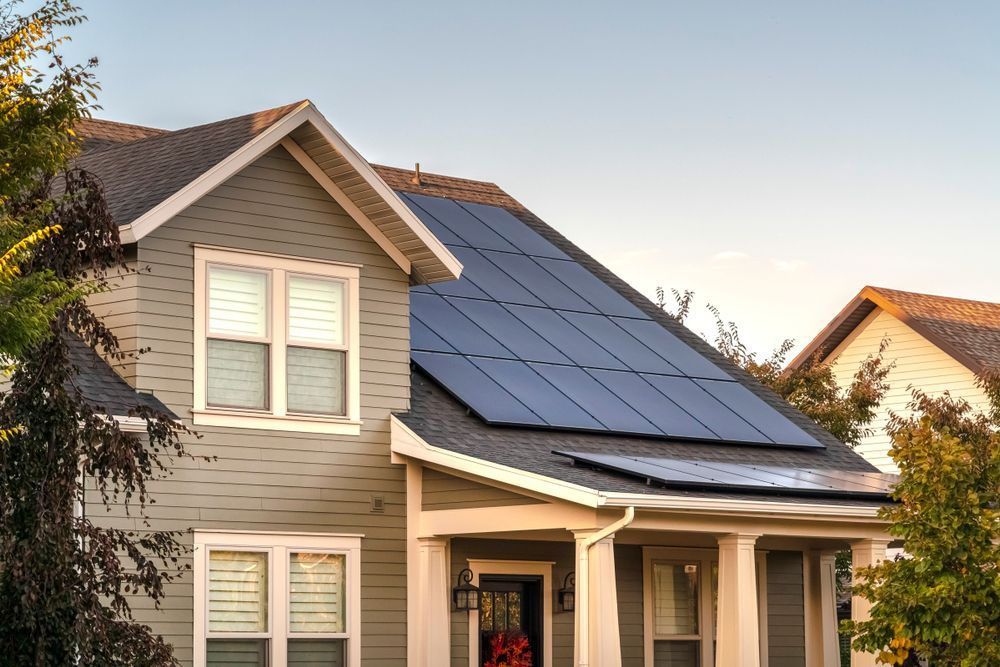 A house with solar panels on the rooftop.