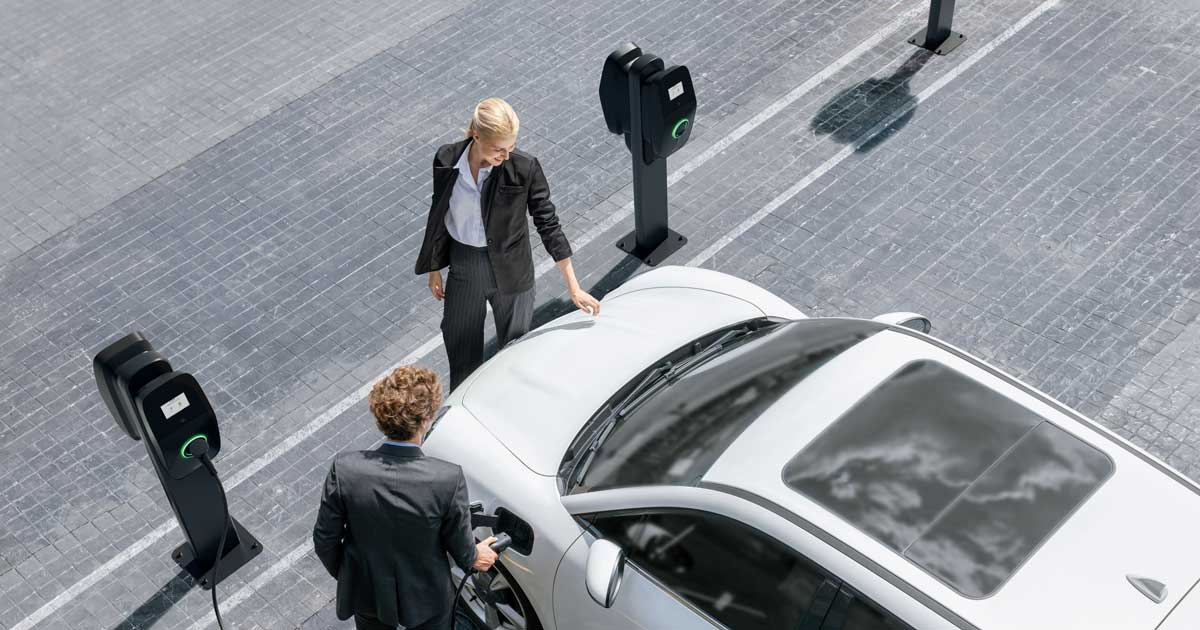 Man using EVBox Liviqo to charge his car.